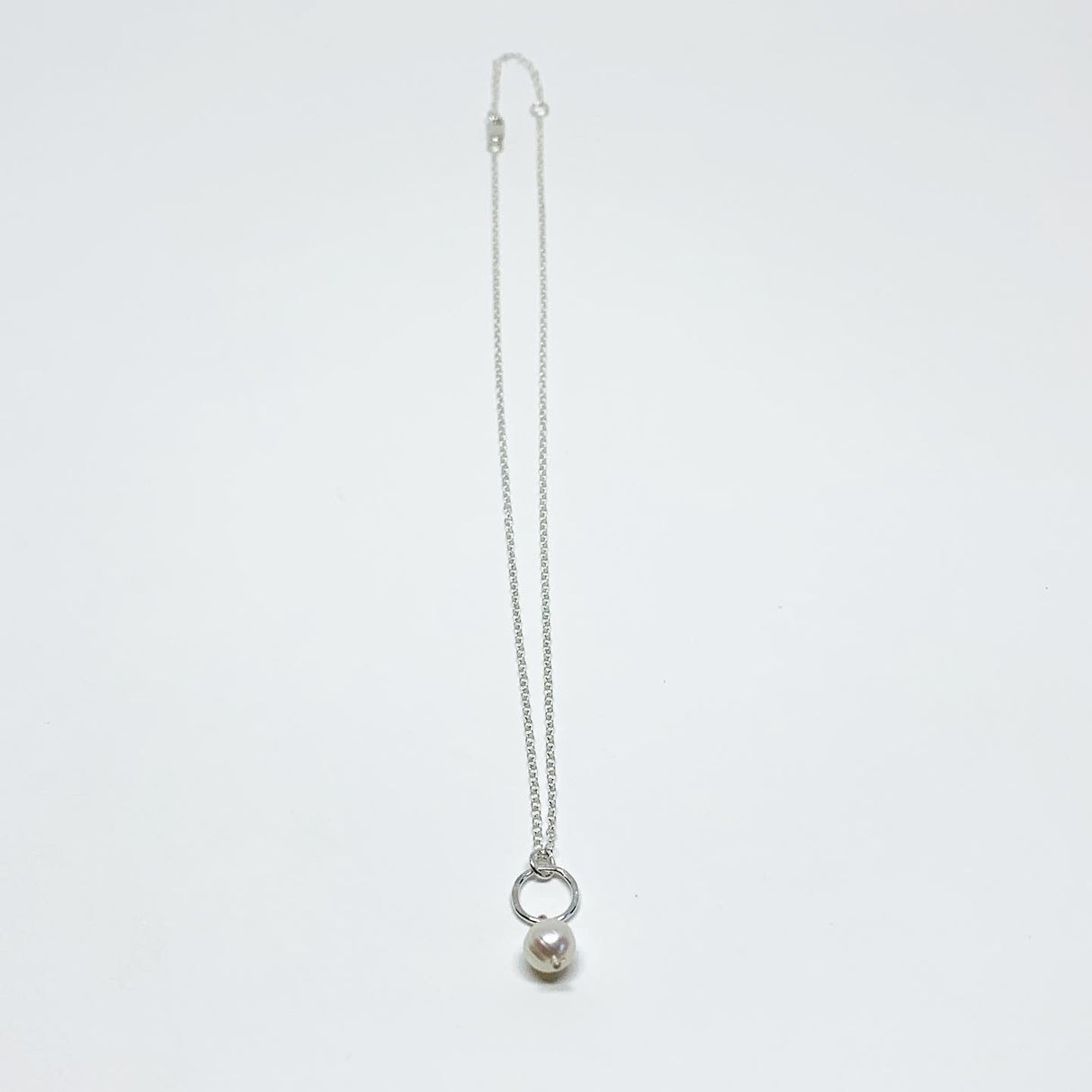 Pearl Drop Charm Necklace by Jennifer Cervelli Jewelry