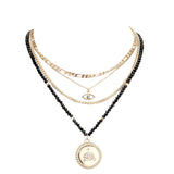 Stone Embellished Evil Eye Pendant Multi Layer Bib Necklace by Madeline Love