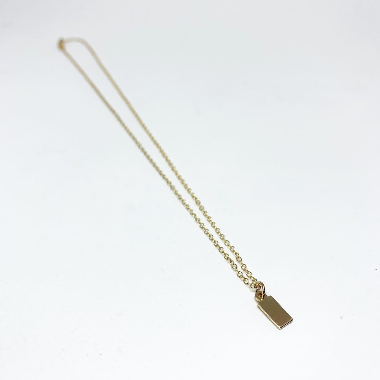 Initial Tag Necklace by Jennifer Cervelli Jewelry