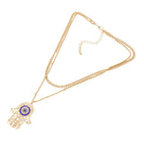 Rhinestone Evil Eye Filigree Hamsa Pendant Layered Necklace by Madeline Love