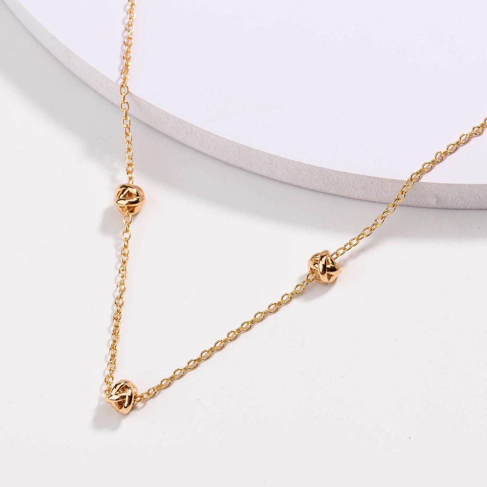 Gold Love Knot Necklace by Hollywood Sensation®