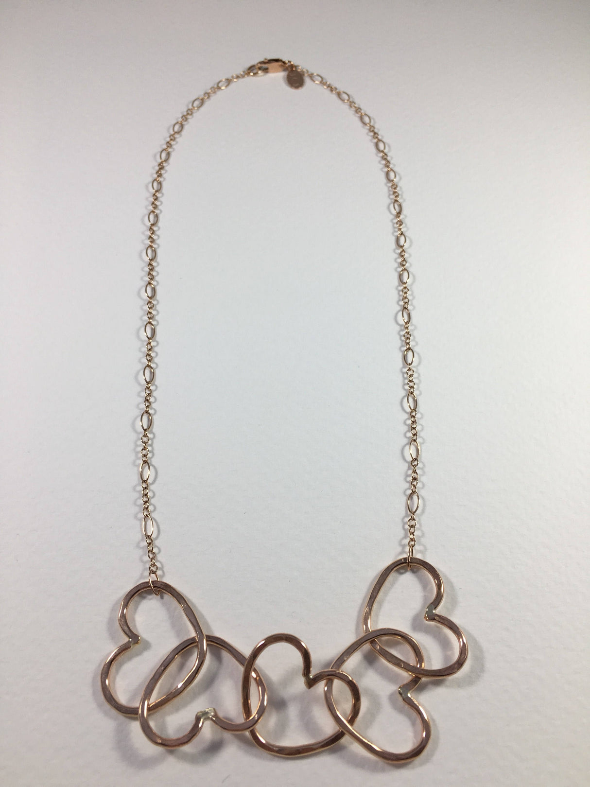 Five Hearts Linked Necklace by Jennifer Cervelli Jewelry