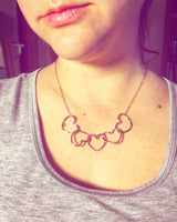 Five Hearts Linked Necklace by Jennifer Cervelli Jewelry