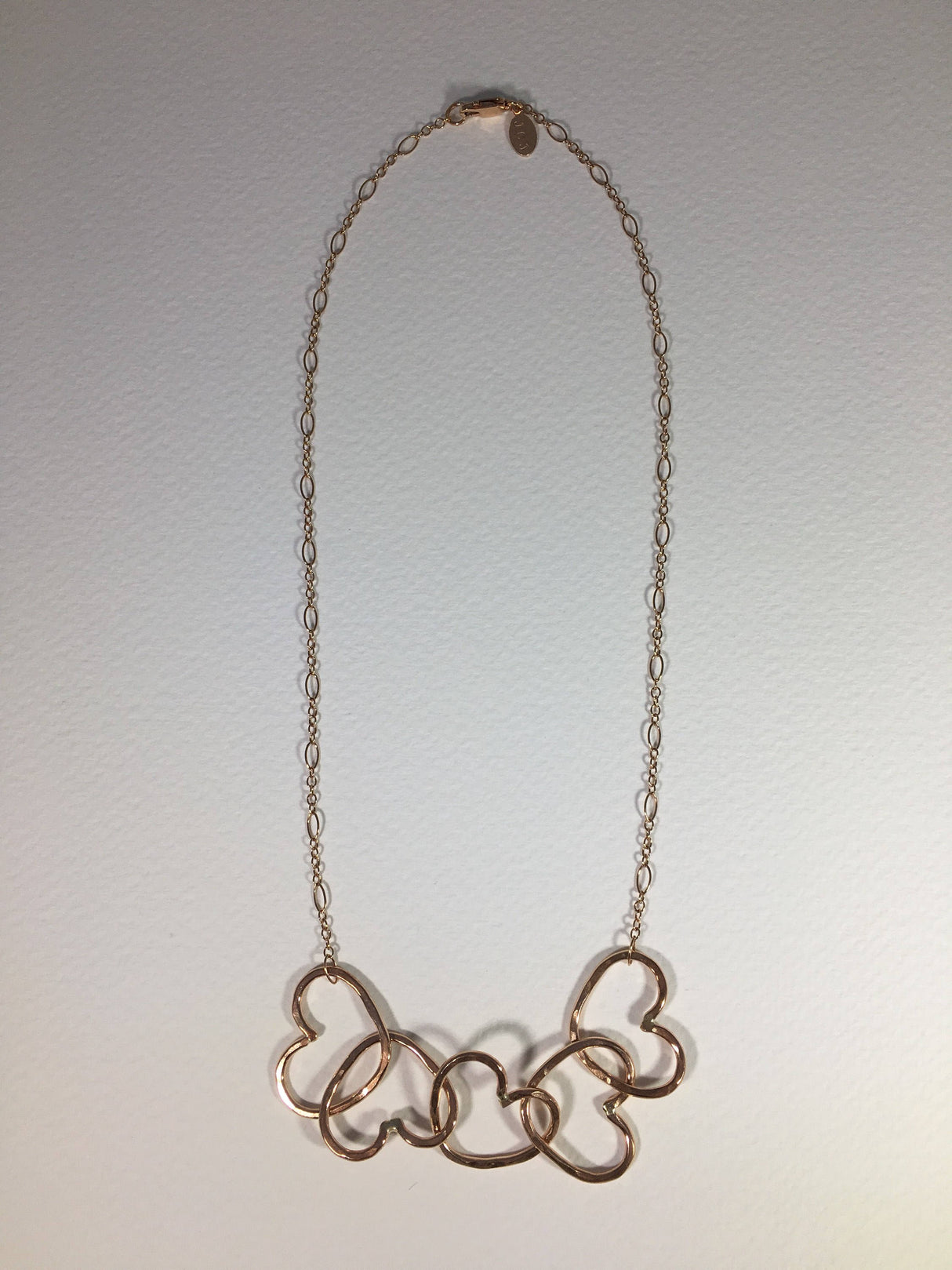 Five Hearts Linked Necklace by Jennifer Cervelli Jewelry