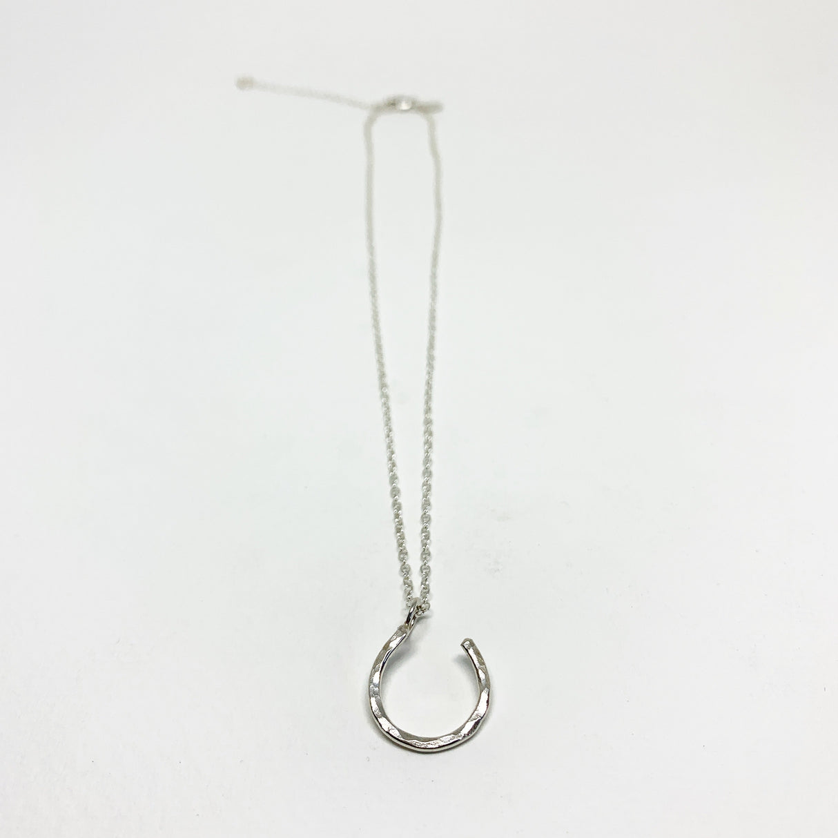 Hanging Lucky Horseshoe Charm Necklace by Jennifer Cervelli Jewelry