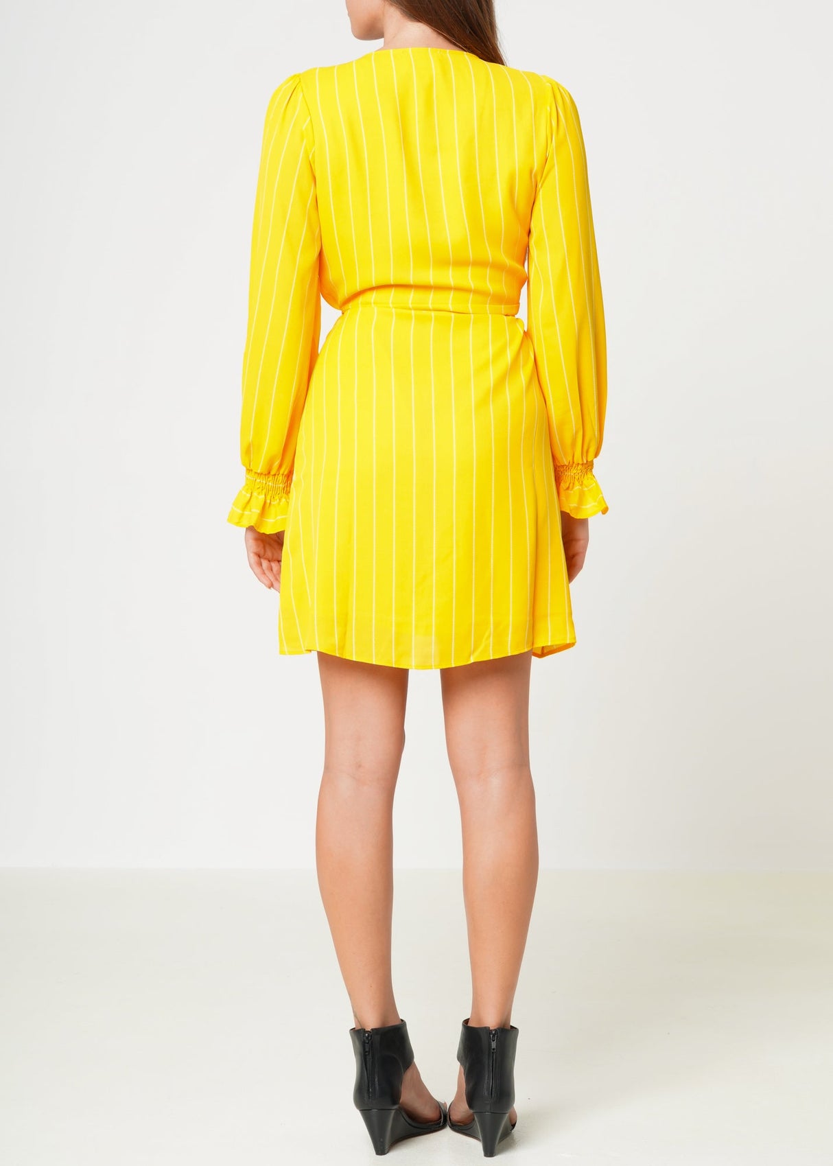 Smocked Bell Sleeve Wrap Dress in Yellow by Shop at Konus