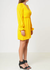 Smocked Bell Sleeve Wrap Dress in Yellow by Shop at Konus