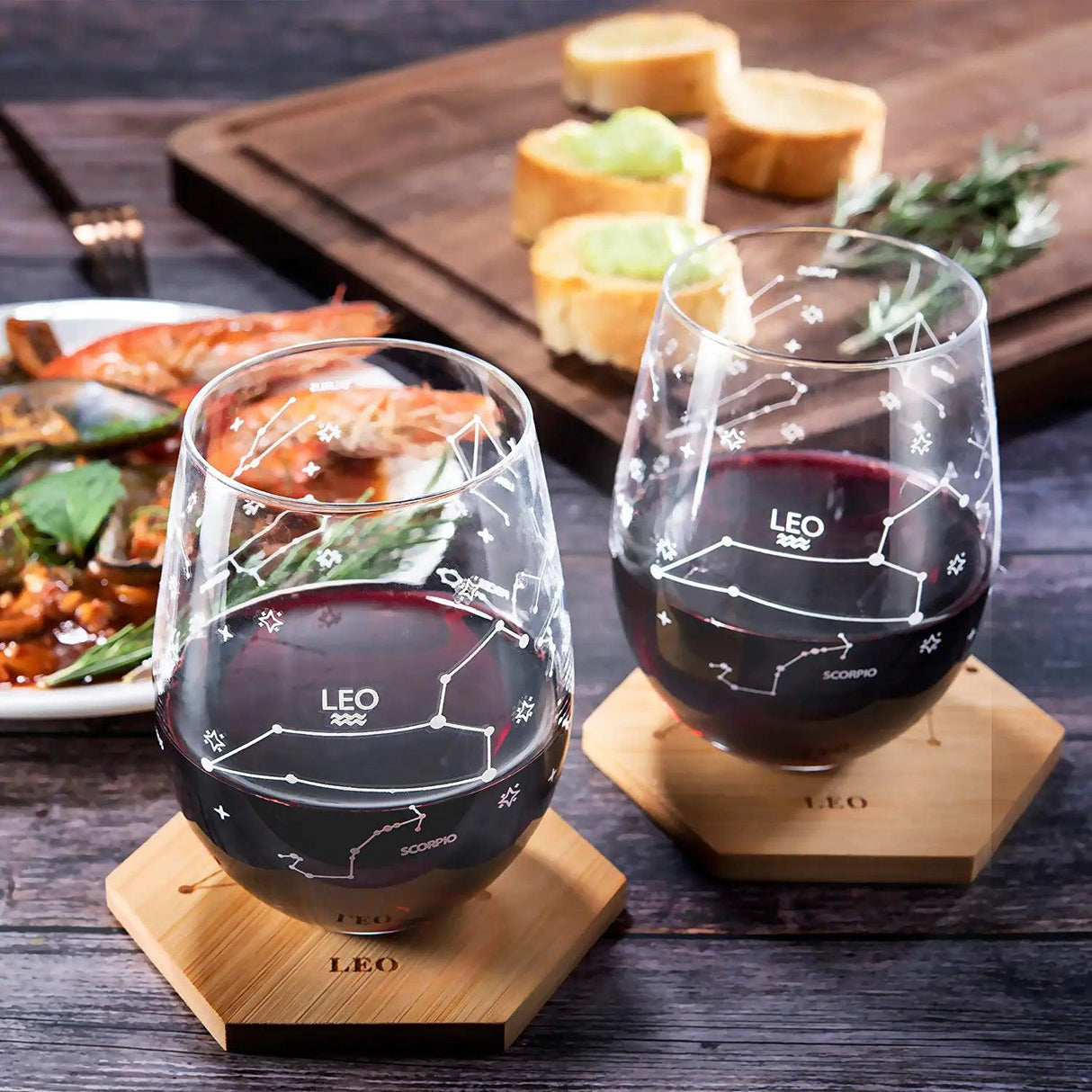 Set of 2 Zodiac Sign Wine Glasses with 2 Wooden Coasters by The Wine Savant - Astrology Drinking Glass Set with Etched Constellation Tumblers for Juice, Water Home Bar Horoscope Gifts 18oz (Leo) by The Wine Savant - Vysn